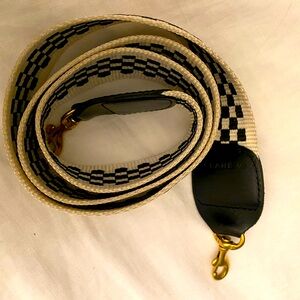 Clare V. Non adjustable crossbody strap. 
Black and Cream Checker.